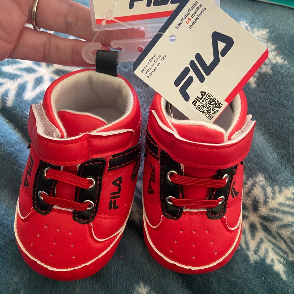 Red and black Fila shoes size 0-6months
